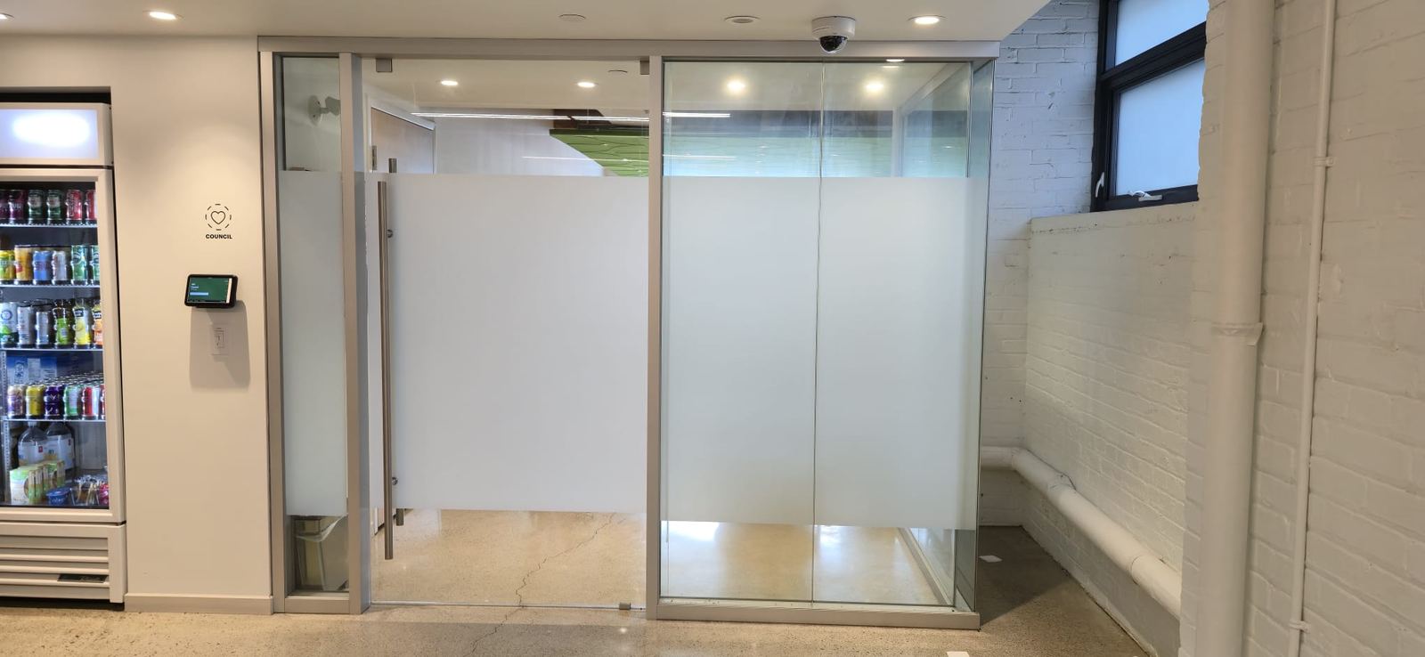 Breakroom sliding glass doors with frosted film