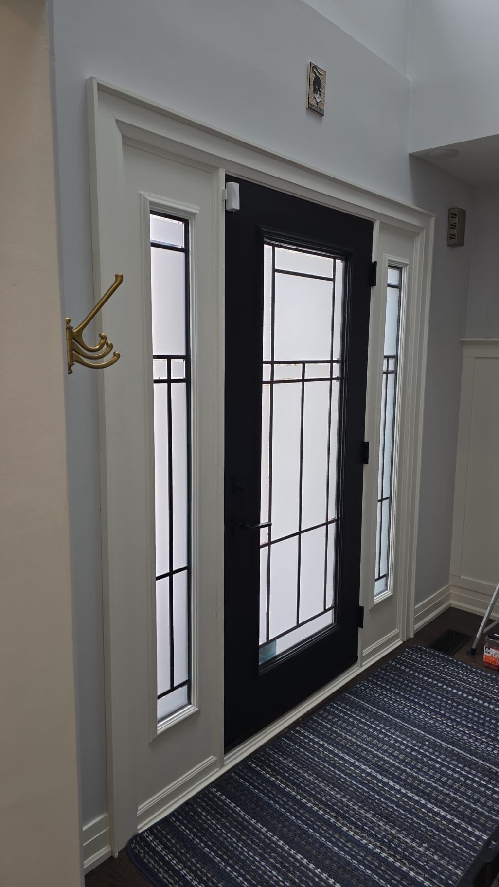 Entry door and sidelights with frosted security film