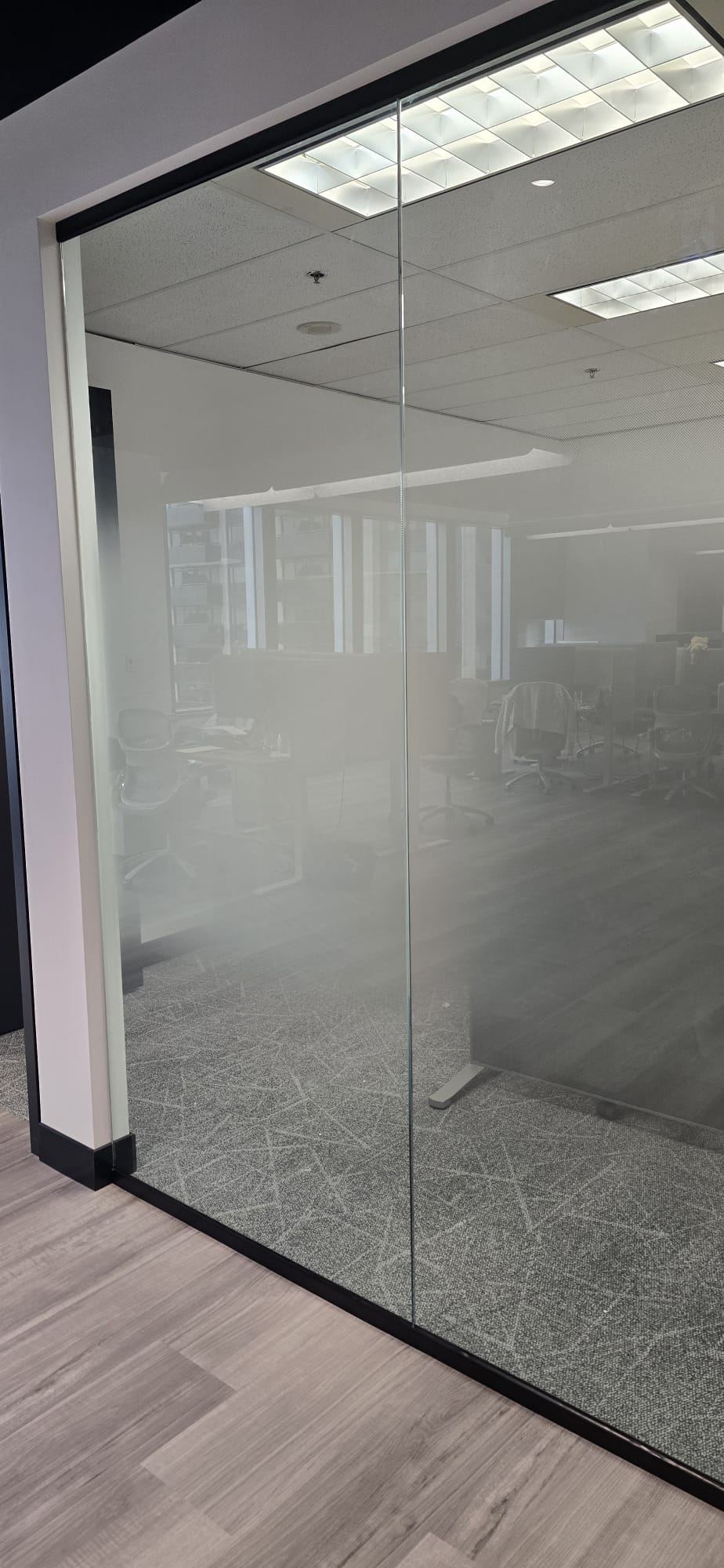 Glass office partition with frosted privacy band